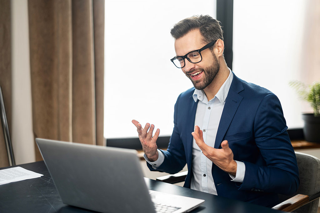 Businessman working on laptop.