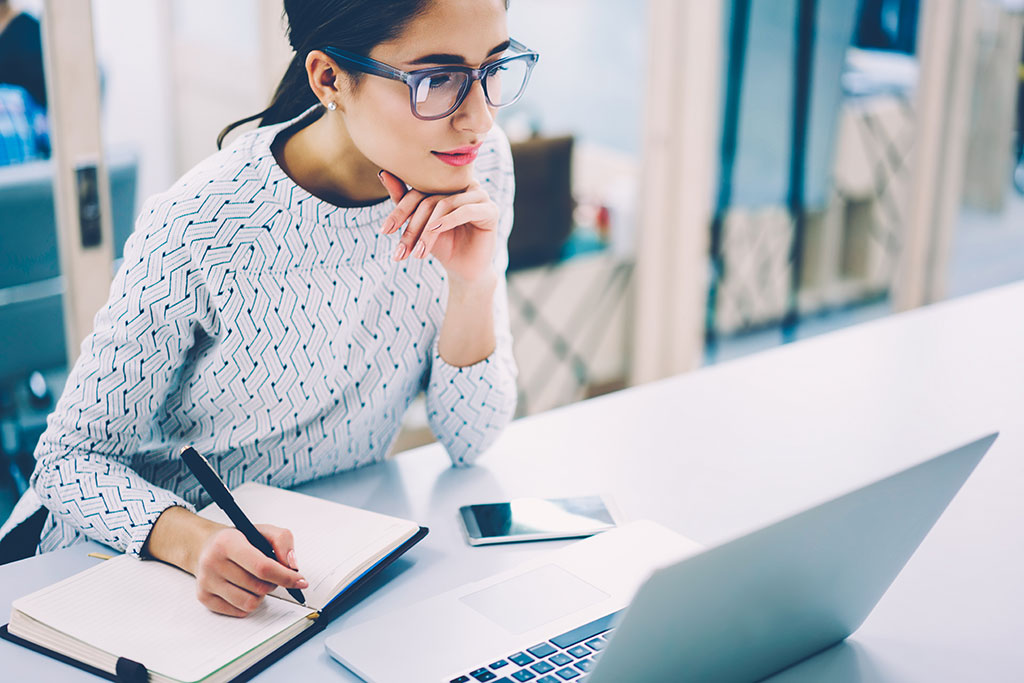 Businesswoman working at laptop.