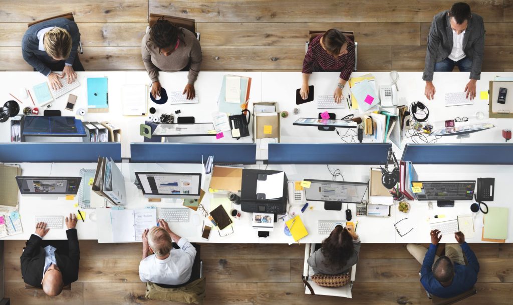 A view from above of worker and IT stations of a local business of the kind found in UK towns like Dartford.