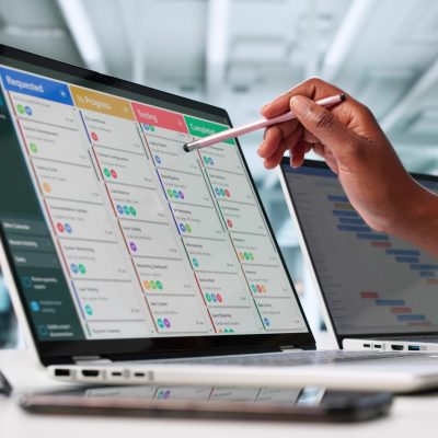 Busy Businesswoman Organizing Content Calendar On Laptop Screen In Office