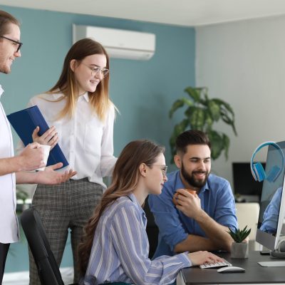Team of programmers working in office