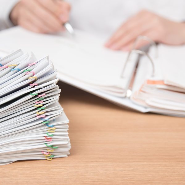 A pile of paperwork that could be digitised and securely stored with the right software
