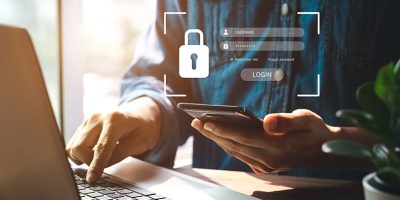 Person entering security code from mobile device